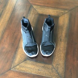 black puma slip on shoes